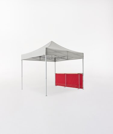 Ecotent® Faltpavillon mit roter halbhoher Seitenwand und integrierter Holztresen.